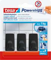 Czarne haczyki Tesa Powerstrips zamocowane na białych płytkach prezentują minimalistyczny styl w łazience