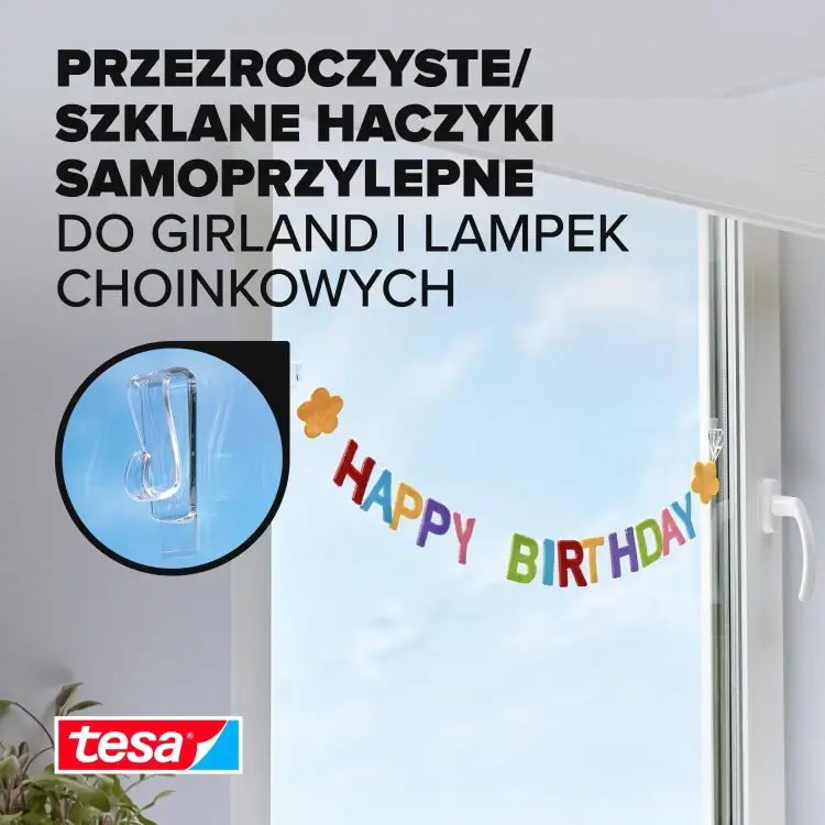 Przezroczysty haczyk Tesa zamocowany na szybie utrzymuje kolorowy napis Happy Birthday nad oknem