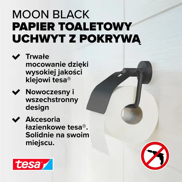 Czarny metalowy uchwyt Tesa MOON z pokrywą prezentuje nowoczesny design na tle jasnej ściany